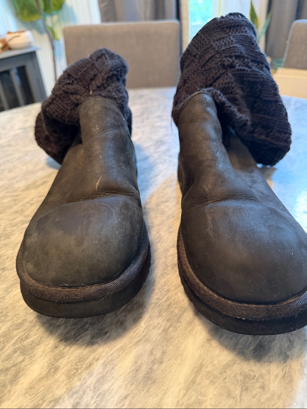 Women’s Black Ugg boots with cable knit details